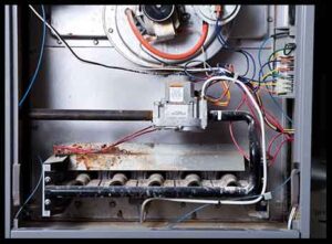 Heating repair in Sea Girt image of open furnace in need of repair