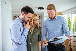 Ortley Beach real estate agent reviewing a property with a couple during an off-season home showing